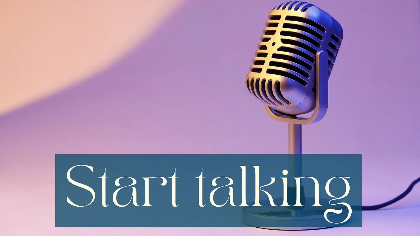 One of those metal vintage microphones standing on a flat surface. The lighting is light purple with a spotlight in the top left corner in the background. White writing on a half transparent petrol background: Start talking.
